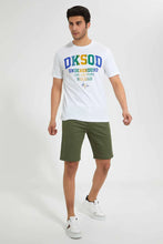 Load image into Gallery viewer, White Crew Neck T-Shirt With Studs تيشيرت باللون الأبيض بياقة دائرية مزينة