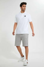 Load image into Gallery viewer, White Polo Shirt With Chest Logo قميص بولو باللون الأبيض بطبعة لوجو